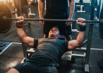 Bench presser arm training to build triceps for powerlifters