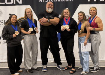 lifters Tori Lam, Kasey Smith, coach John Mazza, Kayla Potter, Leona Hildreth and Leah Stamp display their medals at the 2025 StrengthX Grand Prix.