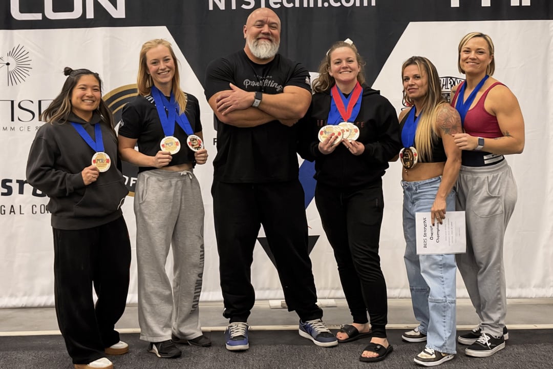 From left, lifters Tori Lam, Kasey Smith, coach John Mazza, Kayla Potter, Leona Hildreth and Leah Stamp display their medals at the 2025 StrengthX Grand Prix.