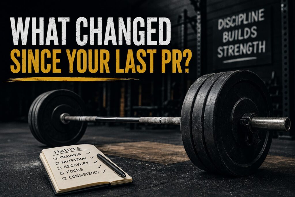Powerlifting barbell beside a habit checklist in a dark gym, illustrating how training consistency, nutrition, recovery, focus, and discipline influence strength plateaus and personal records.